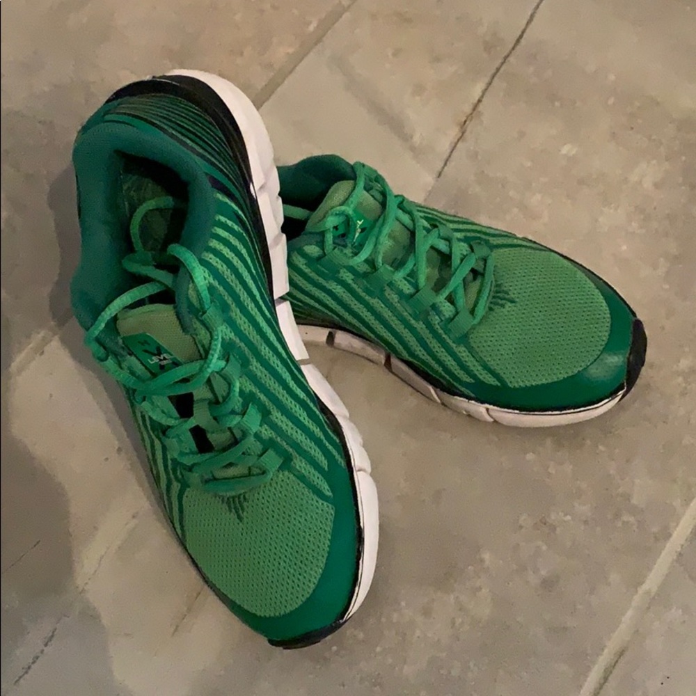 Boys green under armour tennis shoes.
